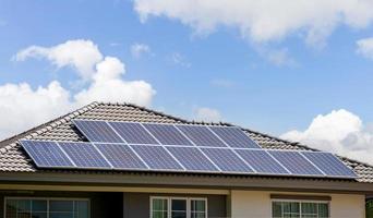 Solar cells panels on the roof of the modern house, Modern eco green house concepts photo