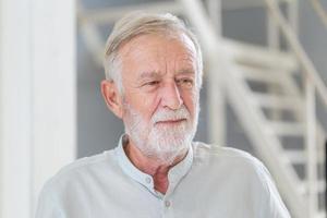 Headshot portrait of senior man at warehouse, Elderly caucasian old man photo