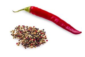 Pepper mix. Black, red and white peppercorns and red chili pepper isolated on a white background. Clipping Path photo