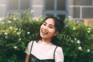 Closeup portrait of young adult asian business woman with green leaf. photo