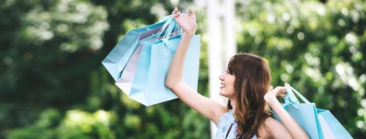 Beautiful smile asian young woman shopping photo