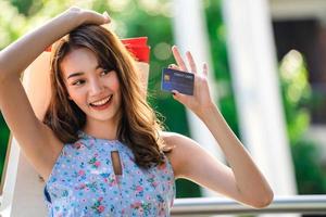 Shopping woman with credit card photo