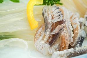 Fresh sashimi live white squid photo