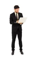 A handsome young man standing on a tablet isolated on white background, photo