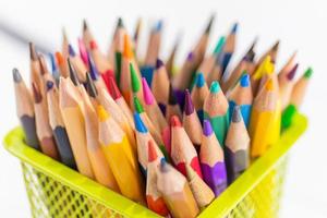 A colored pencil in a yellow basket photo
