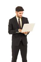 A handsome young man standing on a tablet isolated on white background, photo