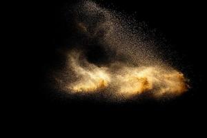 Abstract cloud motion blurred sand background.Sandy explosion isolated on over dark background. photo