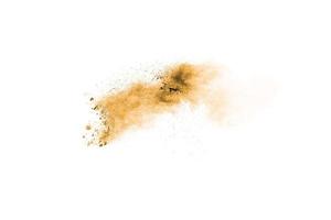 Brown powder dust cloud.Brown particles splattered on white background. photo