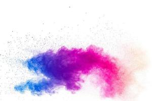 Explosion of colored powder, isolated on white background photo