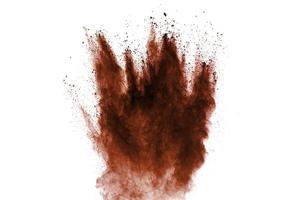 Red dust particles explosion on white background.Red sand splash. photo