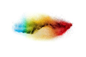 Multi colour powder explosion on white background. Launched colourful dust particles splashing. photo