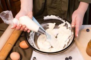 process making homemade chocolate cupcake with cream photo