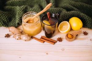 Cup warm water with lemon, honey, ginger, cinnamon and anise. photo