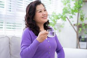 Portrait of senior Asian woman at home photo