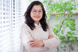 Portrait of senior Asian businesswoman at home photo