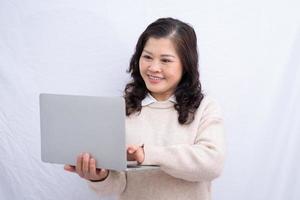 Portrait of senior Asian woman on white background photo