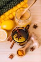 Cup warm water with lemon, honey, ginger root, cinnamon and anise. photo