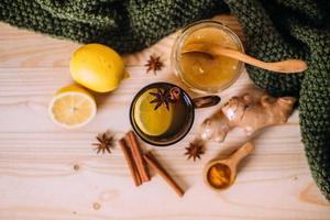Cup warm water with lemon, honey, ginger, cinnamon and anise. photo