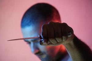 angry man having knife going to kill photo