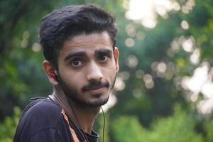 portrait of indian innocent young man at outdoor photo