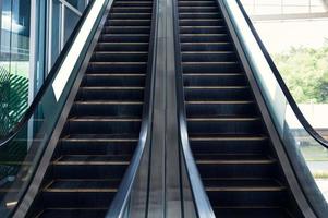 Electric escalators with railing moving up and down photo