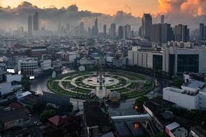 Wongwianyai roundabout monument without cars and skyscraper in downtown at Bangkok, Thailand photo