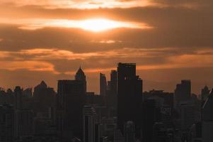 Sunrise over high-rise office building in business district at Bangkok photo