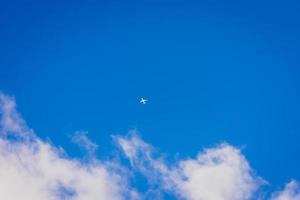 Airplane over clouds space in background, Choice of travel. photo