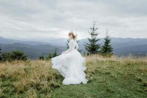 Photoshoot of the bride in the mountains. Boho style wedding photo. photo