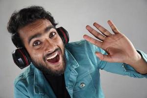 Commencing high during video call wearing headphone in white background studio sort photo