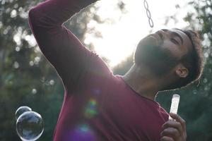 A boy making the bubbles photo