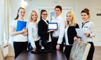 Group of students studying using a laptop photo