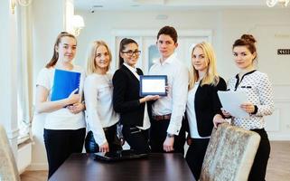 Group of students studying using a laptop photo