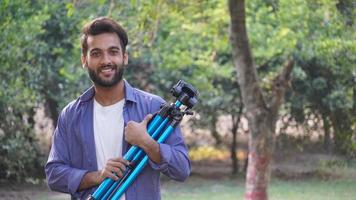 man standing with tripod - Blog images, Photography concept photo