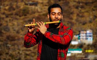 man with flute indian bansuri Close view image photo