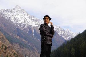 man giving pose front of camera in manali photo