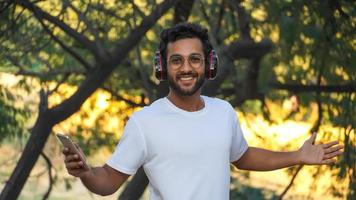 a man with headphone smiling photo