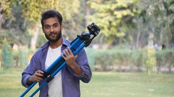 man standing with tripod - Blog images, Photography concept photo