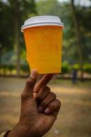 a paper cup image in hand photo