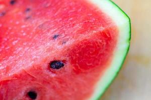 Red watermelon slice closeup fresh fruit photo