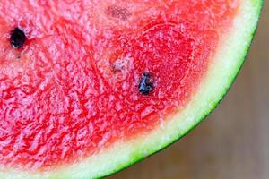 Red watermelon slice closeup fresh fruit photo