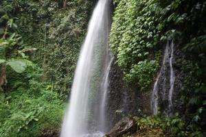 waterfalls rushing on the rocks below photo