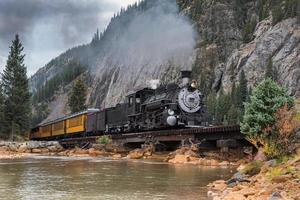 Vintage Steam Train With Autumn Scenery Background. photo