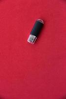 USB flash drive on a red background photo