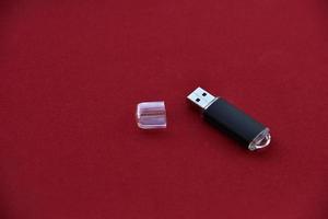 USB flash drive on a red background photo