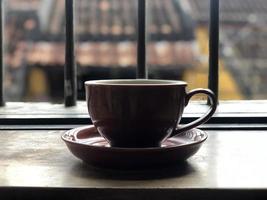 Hot coffee cup on table in restaurant photo