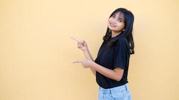 Portrait young girl with copy space on orange background. photo