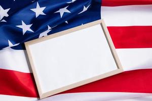 American flag and empty frame for text.