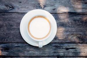 Coffee cup on wood. photo