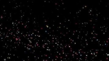 de nombreuses particules d'étoiles brillantes colorées flottent video
